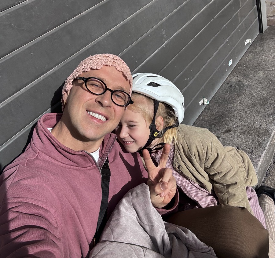 Dad and daughter taking a selfie after a bike ride